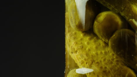pickled cucumbers in a jar