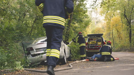 car accident and rescue by firefighters