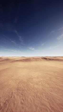 a vast, empty desert under a blue sky