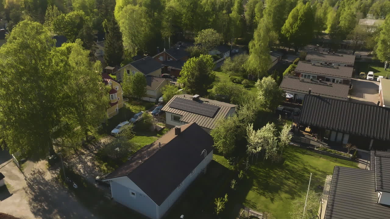 Aerial vierw circling homes powered by solar energy, summer day in Finland