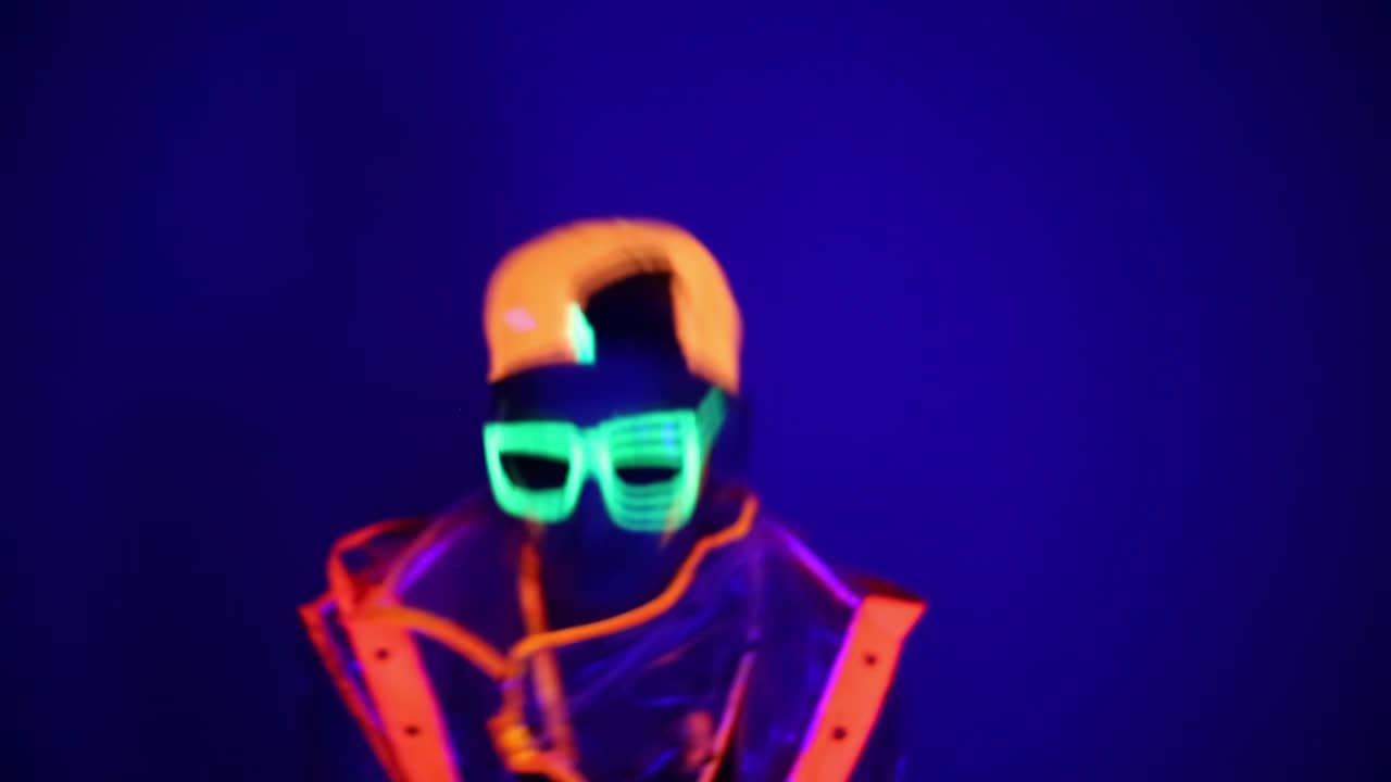 Guy dancing in neon costume