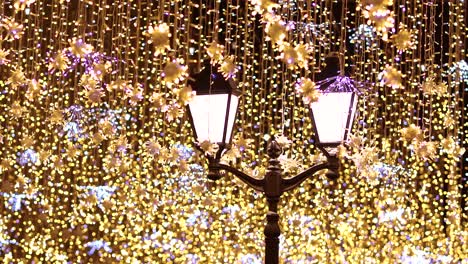 street lantern with decorative christmas garlands. new year and christmas celebration.