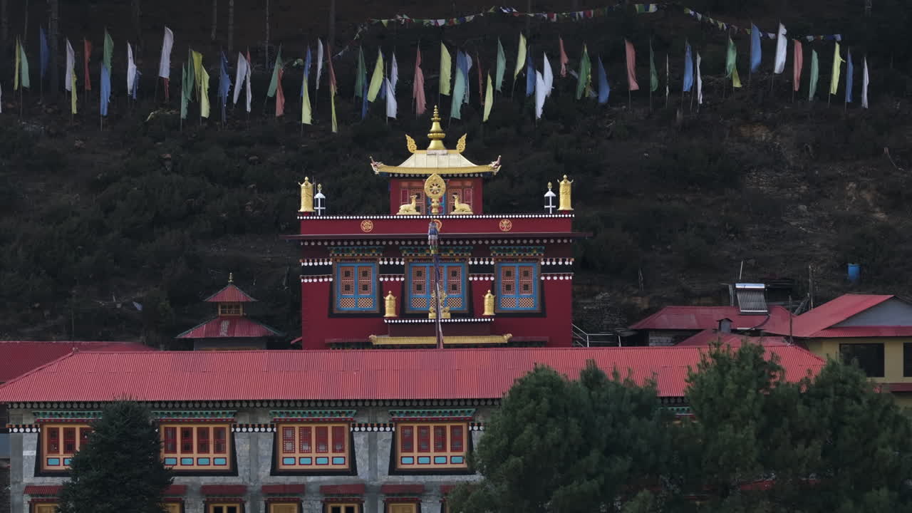 Aerial telezoom approaching the Phakding Monastery, in hazy Sagarmatha, Nepal