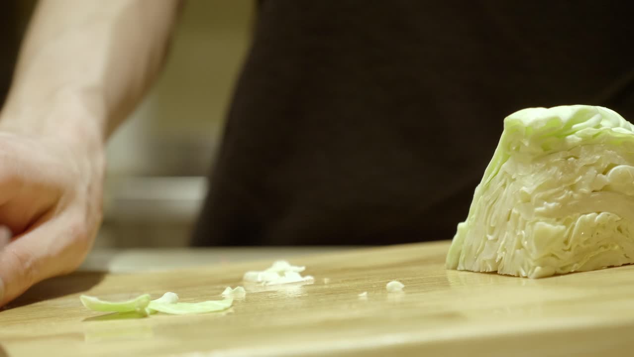 Slicing Fresh Cabbage On Wooden Cutting Board