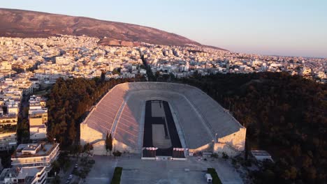 Orbiting-drone-video-of-the-the-Panathenaic-Stadium-in-Athens,-Greece-during-a-sunset