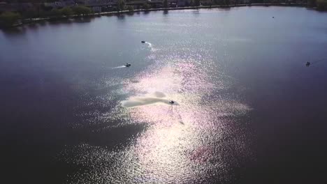 drone flying above floating boats