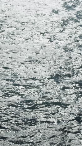 small boat on rippled ocean water