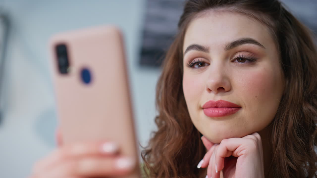 Office girl reading message smartphone in light interior closeup. Happy manager