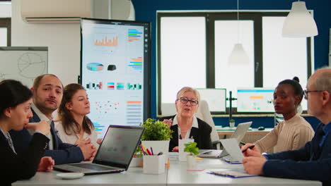 group of diverse business people discussing with partners on video call