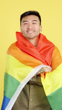 man with lgbtq+ pride flag