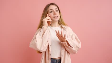 young woman talking on phone with different expressions on pink background