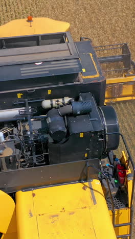 combine harvester in action on the field. combine harvester. harvesting machine for harvesting a wheat field. vertical video