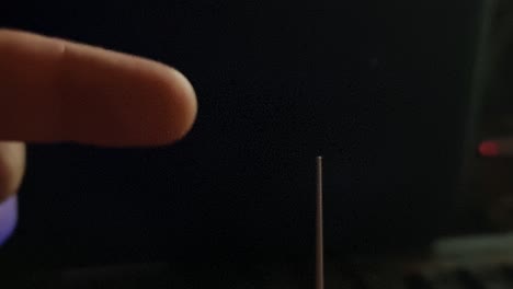 pointing finger connecting to lightning sparks from high voltage tesla generator