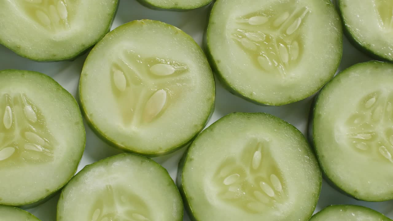 Fresh cucumber and slices rotation.