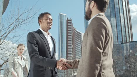 business partners in front of office center