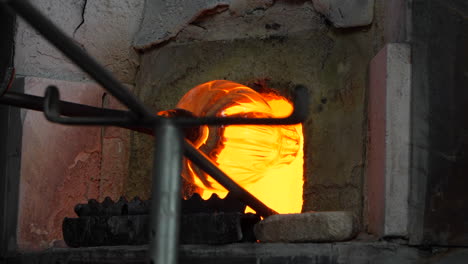 demonstration of glass blowing in a workshop in murano. close up