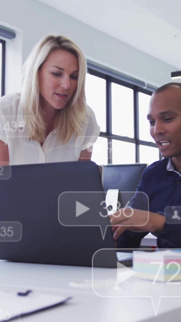 Animation of changing numbers, icons, diverse coworkers discussing reports on laptop in office
