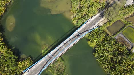 aerial view of soge bridge, the bridge located in pacitan district has a beautiful view of the beach and a large river surrounded by hills