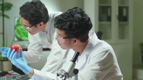 medical team researchers apple analyzing botany expertise on computer discovering genetic mutation. pharmaceuticals scientist working in biochemistry laboratory at biological agriculture experiment