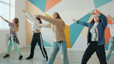 teen girls dancing in a dance studio