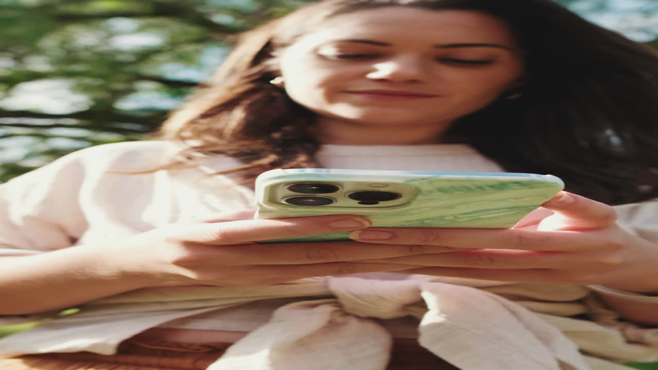 Woman using her smartphone outdoors