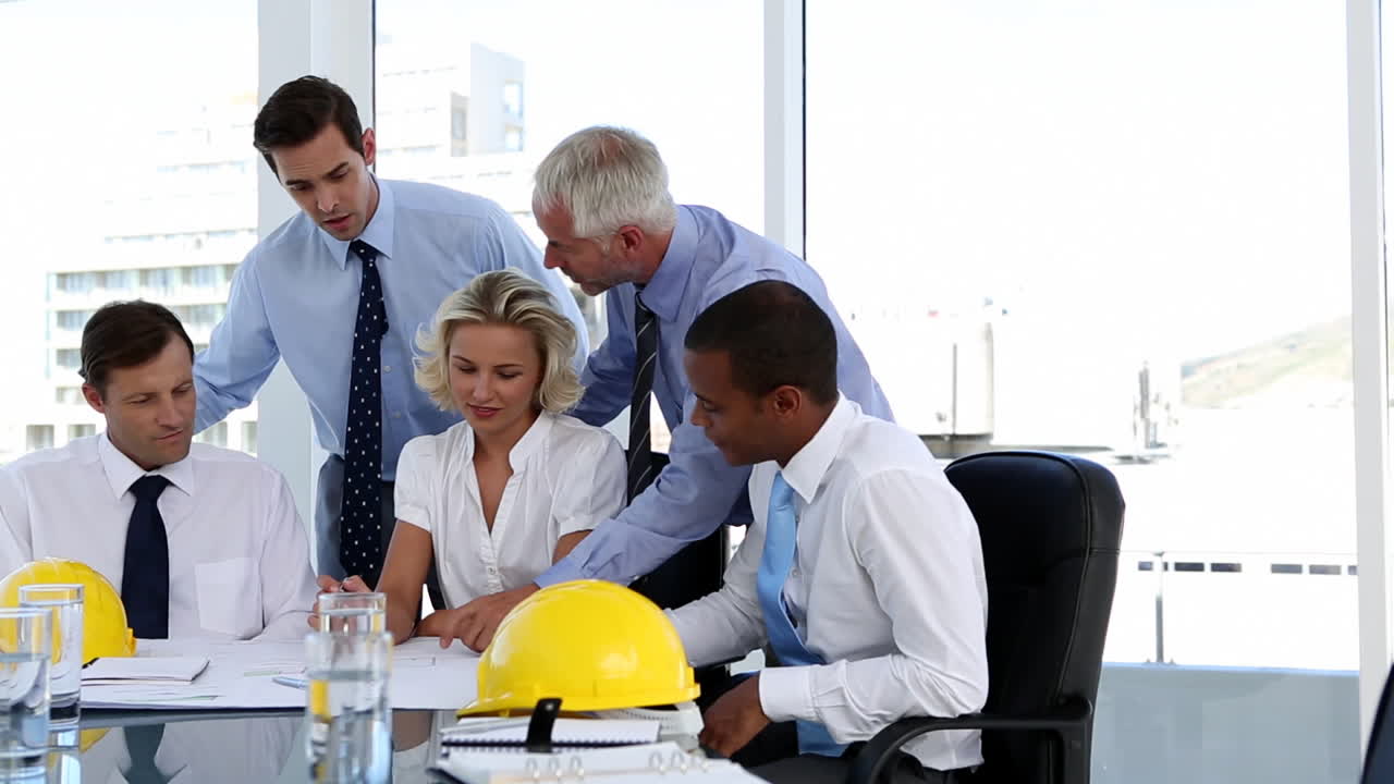 Group of architects looking at plans