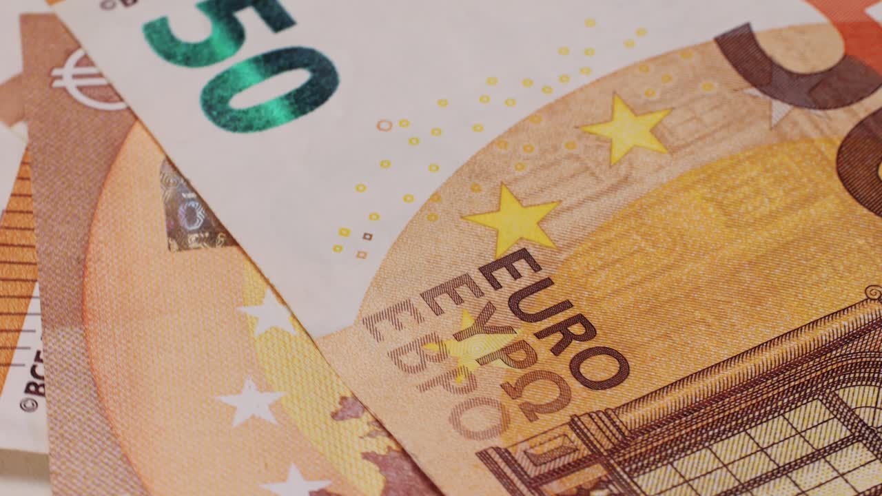 Fifty euro banknotes close-up. European currency EUR, EU Central Bank. 50 euro money macro. Economy, financial and banking concept in European union.