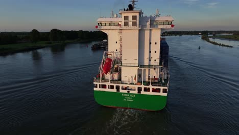 large container ship 'panda 003' navigating a waterway