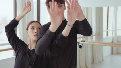 duet performing contemporary improvisation in dance studio