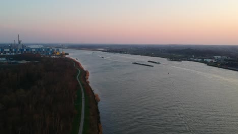 Timelapse-of-barges-passing-at-Antwerp-international-Port,-Belgium