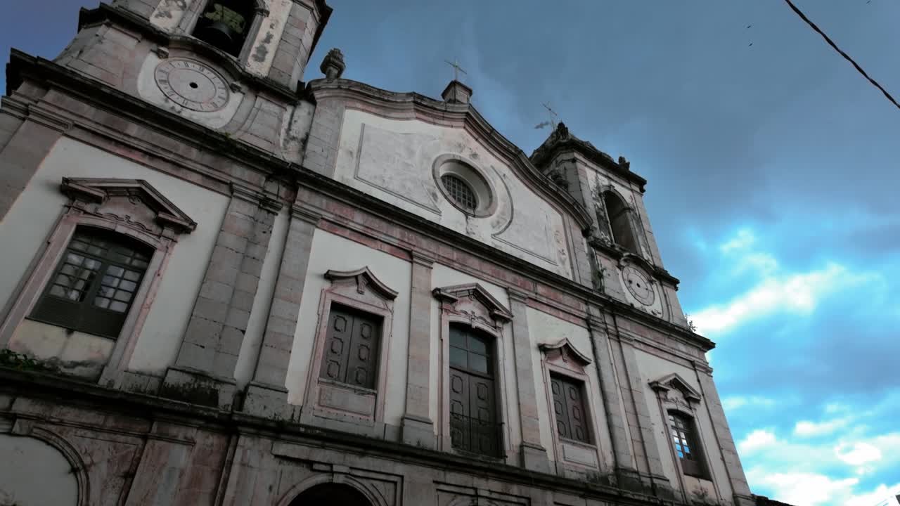 Grand historic church with intricate architecture under a cloudy sky
