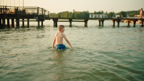 The-boy-enters-the-lake-–-slow-motion