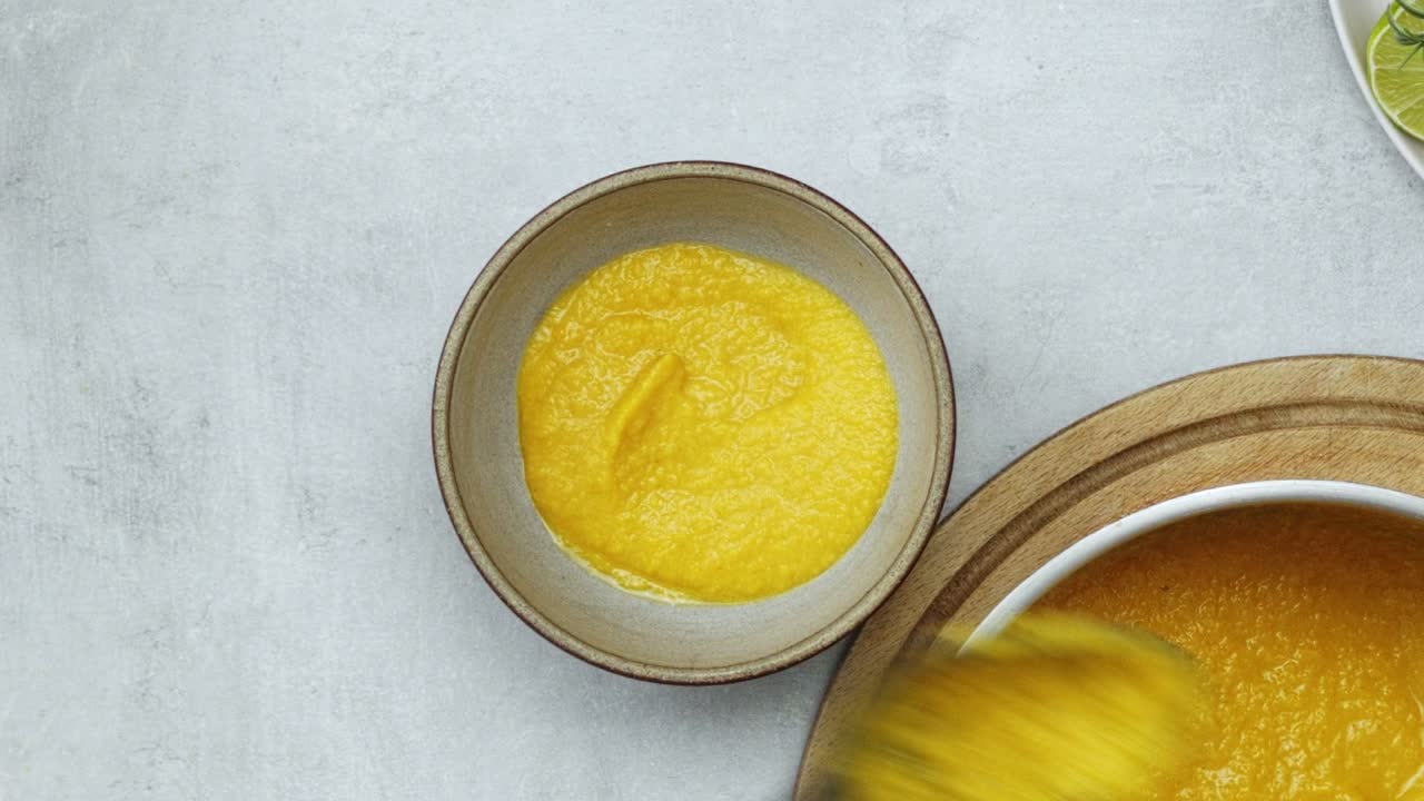 Unrecognizable person serving chickpea puree