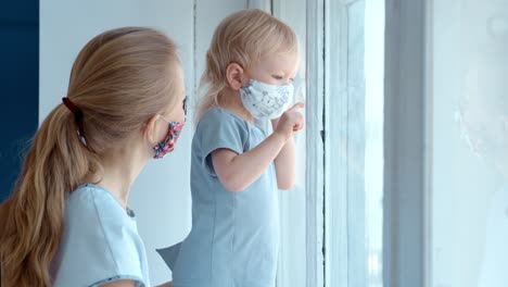 mother and child looking out a window
