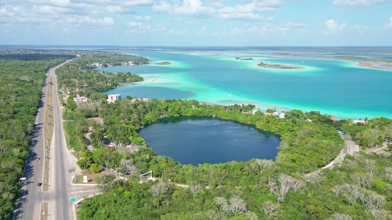 Bacalar lagoon, showcasing vibrant turquoise water and lush landscape, aerial view