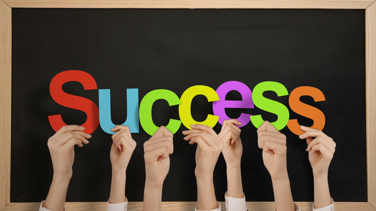 Hands holding up success