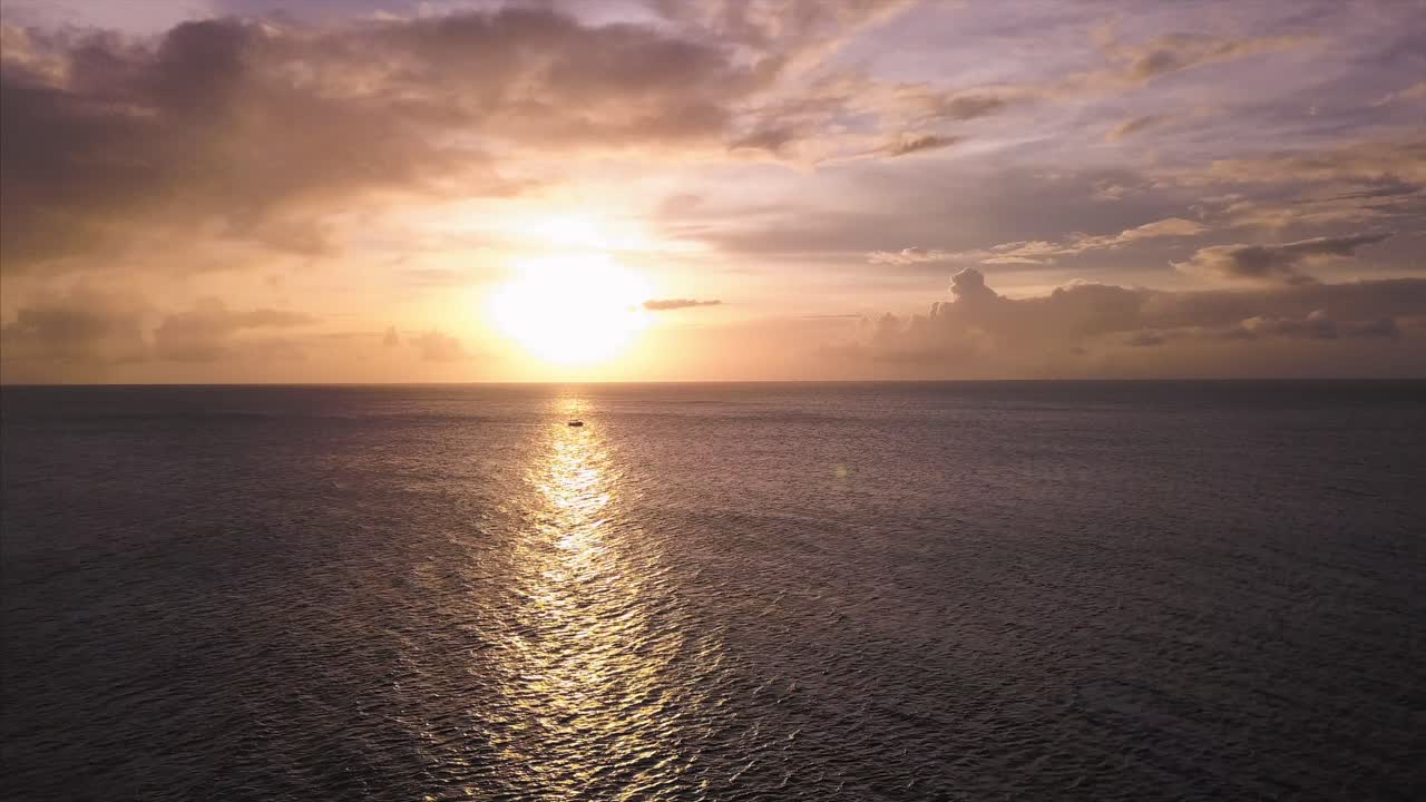Saint Lucia sunset with a sailboat passing by.  This video was taken in 2018.