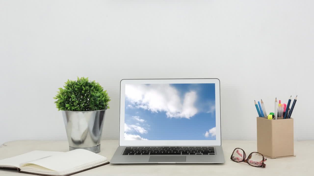 Blue sky and clouds on laptop screen