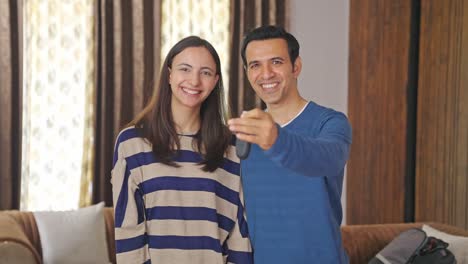 Happy-Indian-couple-bought-a-new-car