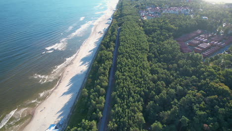 Long-Stretch-Of-White-Sandy-Beach-With-Lush