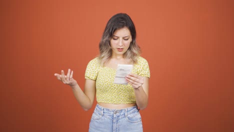 angry young woman with high bill.