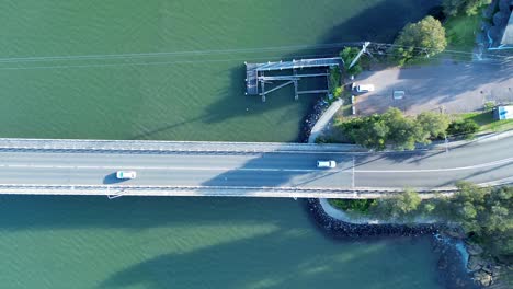 drone aerial landscape view of cars driving over toukley bridge gorokan boat ramp central coast travel transport australia