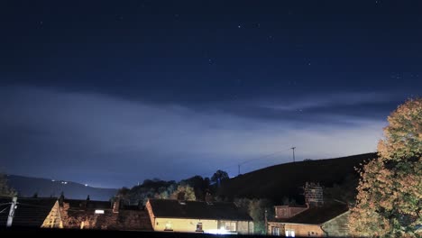 clouds stars and country side , night passing by in the small town of todmorden