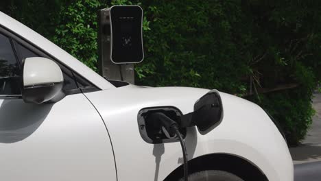 Progressive-concept-of-electric-car-parking-and-recharging-at-charging-station.