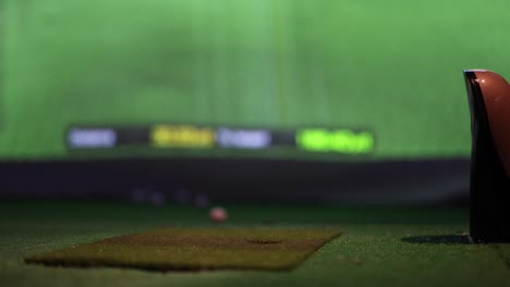 golf club hitting ball in virtual simulation