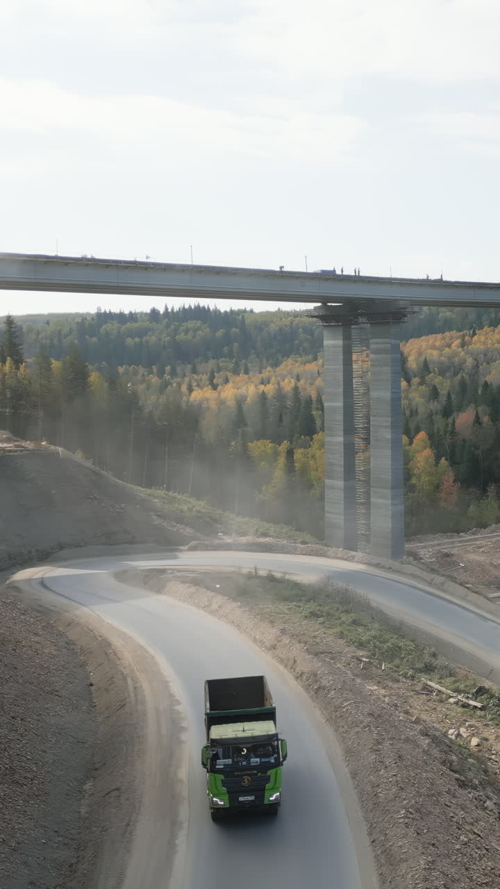 Construction of a Bridge with Trucks and Heavy Machinery