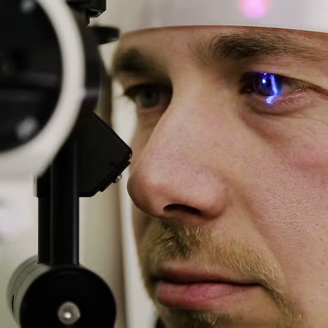 man having eye test
