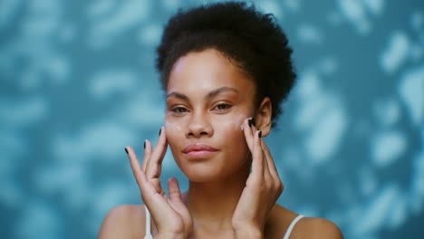 woman applying face cream