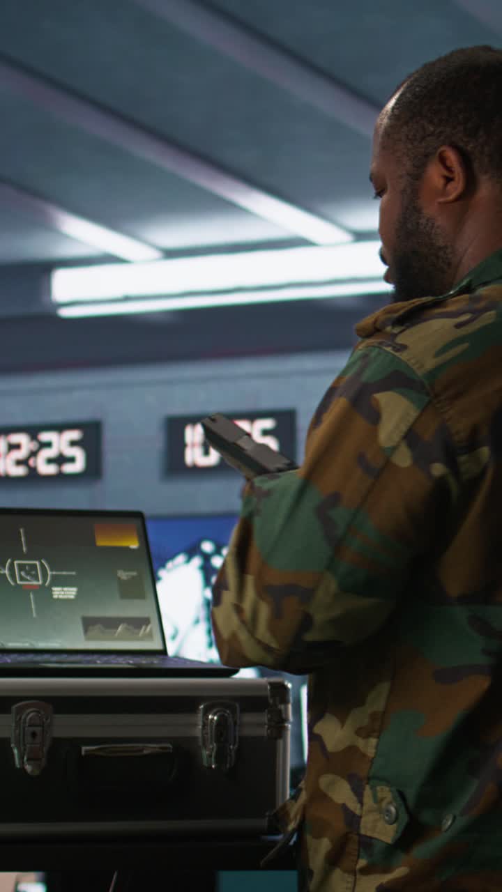 Vertical video Army expert doing reconnaissance to gain intel helping troops
