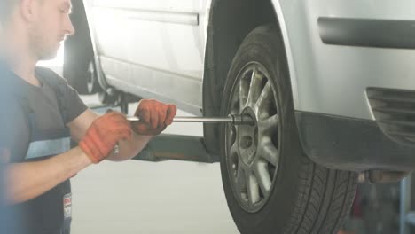 car mechanic changing a tire